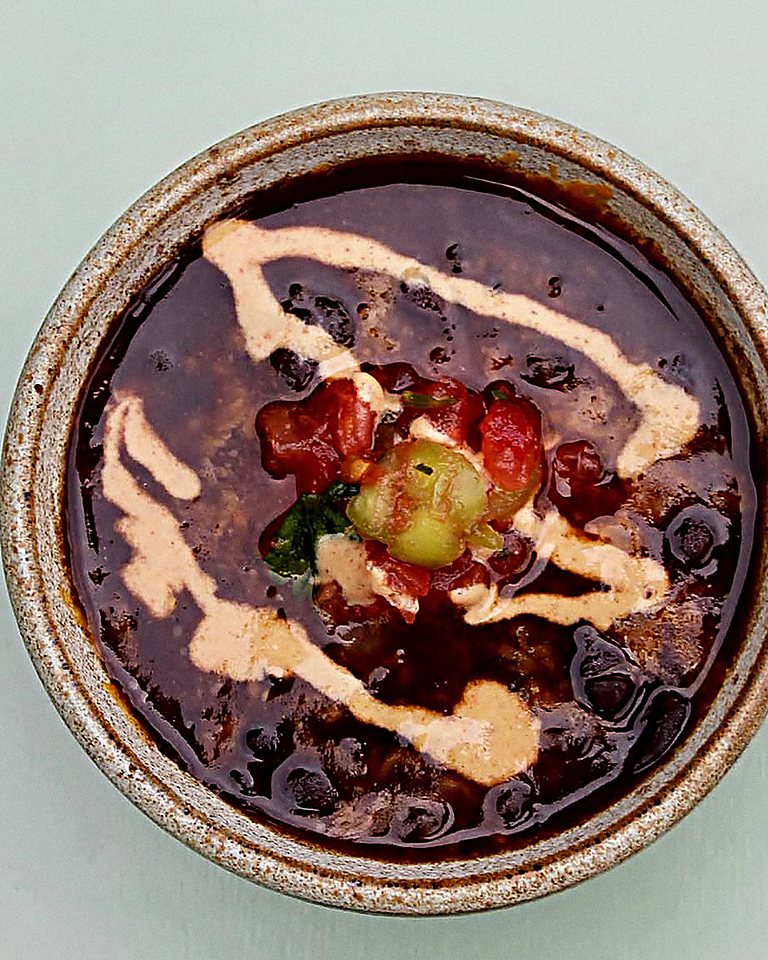 Black bean chilli drizzled with Oh Mommy! sauce.